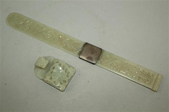 A Chinese pale celadon jade belt buckle section and a similar page turner, late 19th century, 28.5cm, broken with an old silver repair